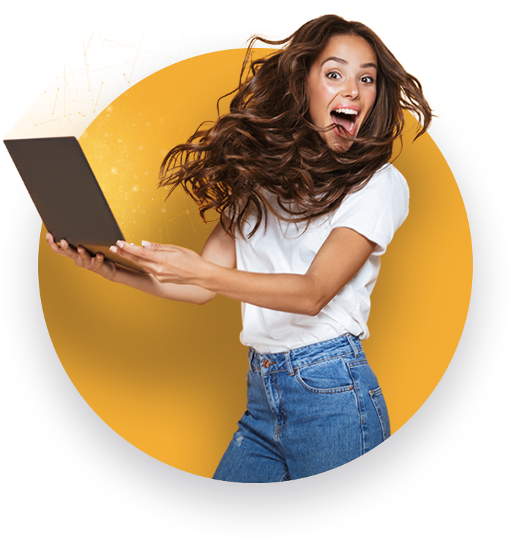 Girl jumping with an overjoyed expression holding a computer in both hands